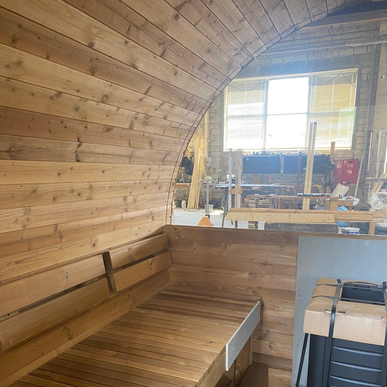 Interior view of the Stellar With Relax Room 6-person barrel sauna