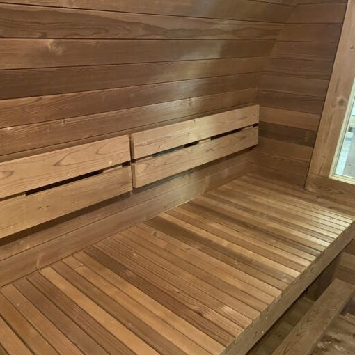 Interior view of the Stellar With Relax Room 6-person barrel sauna