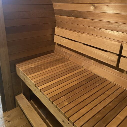 Interior view of the Stellar With Relax Room 6-person barrel sauna