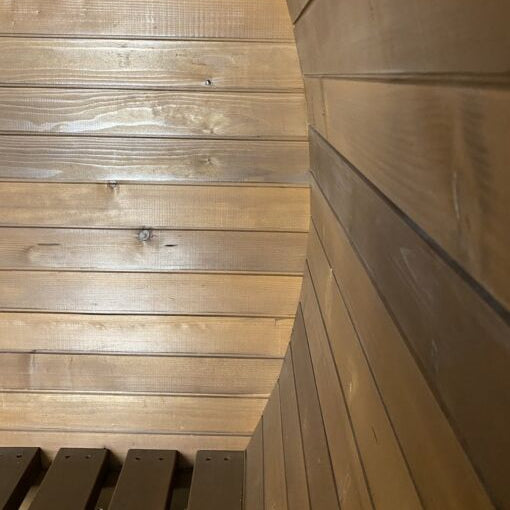 Interior view of the Stellar With Relax Room 6-person barrel sauna