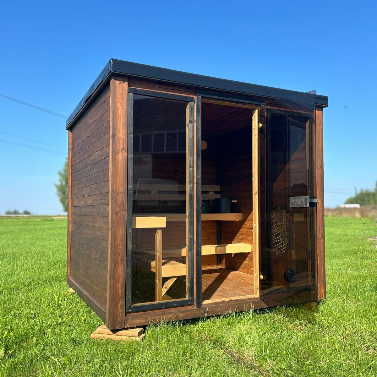 Grand Monarch Traditional Outdoor Sauna on a field Front view