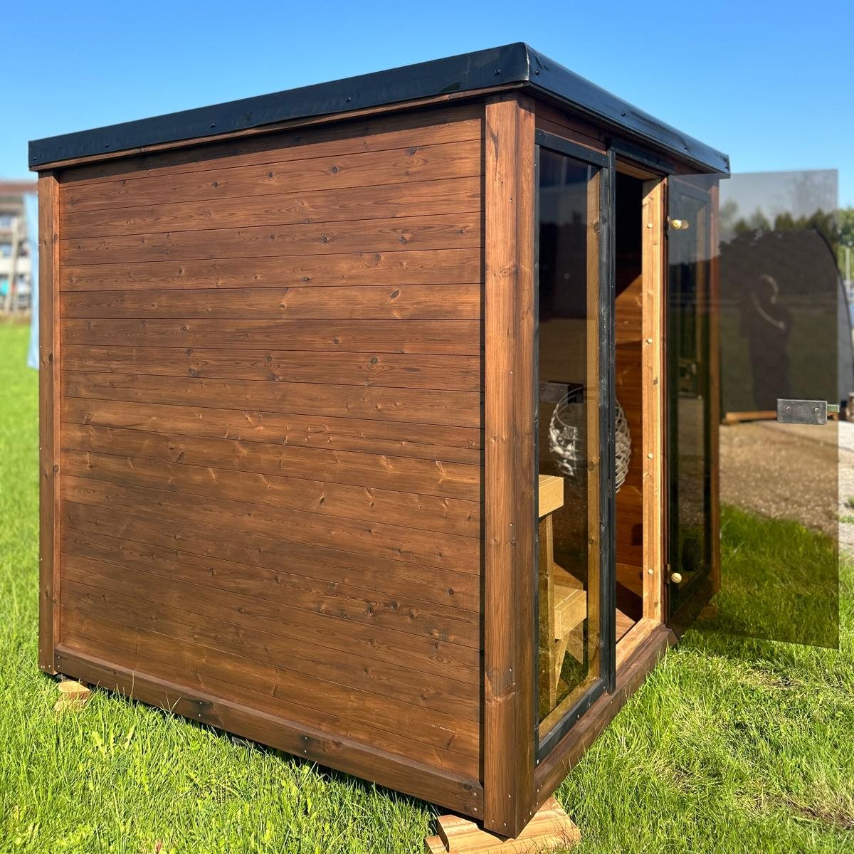 Grand Monarch Traditional Outdoor Sauna on a field Side view