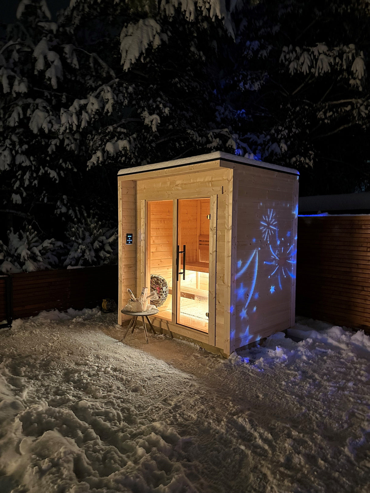 Front Side view of Flora Sauna Exterior on a snowy backyard