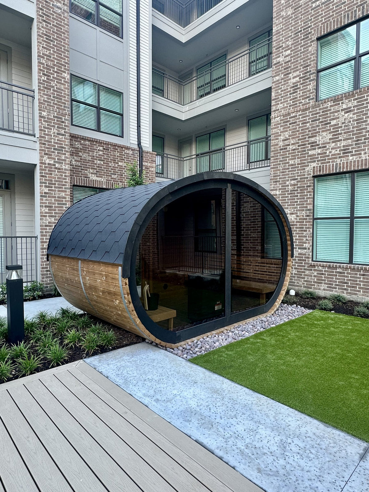 Barrel sauna in a residential courtyard