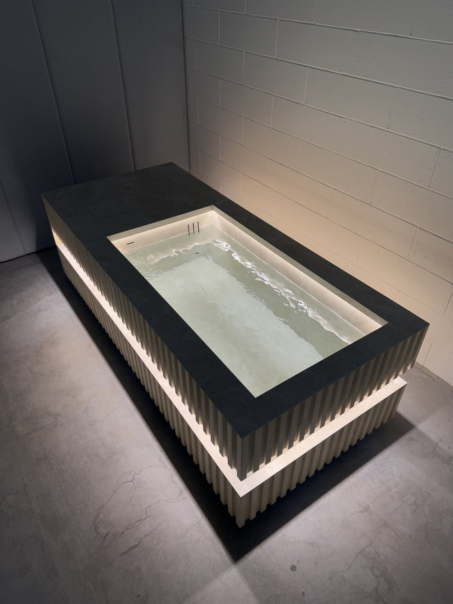 Stone-top cold plunge with backlit base