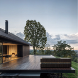 Loki Thermo Ash-Desir Noir cold plunge on the deck of a modern house at dusk