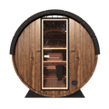 Front of the Grand Nordic Traditional Outdoor Barrel Sauna with a glass door and wooden benches inside.