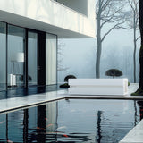Loki Ardesia Bianco cold plunge beside a reflecting pool at a modern home