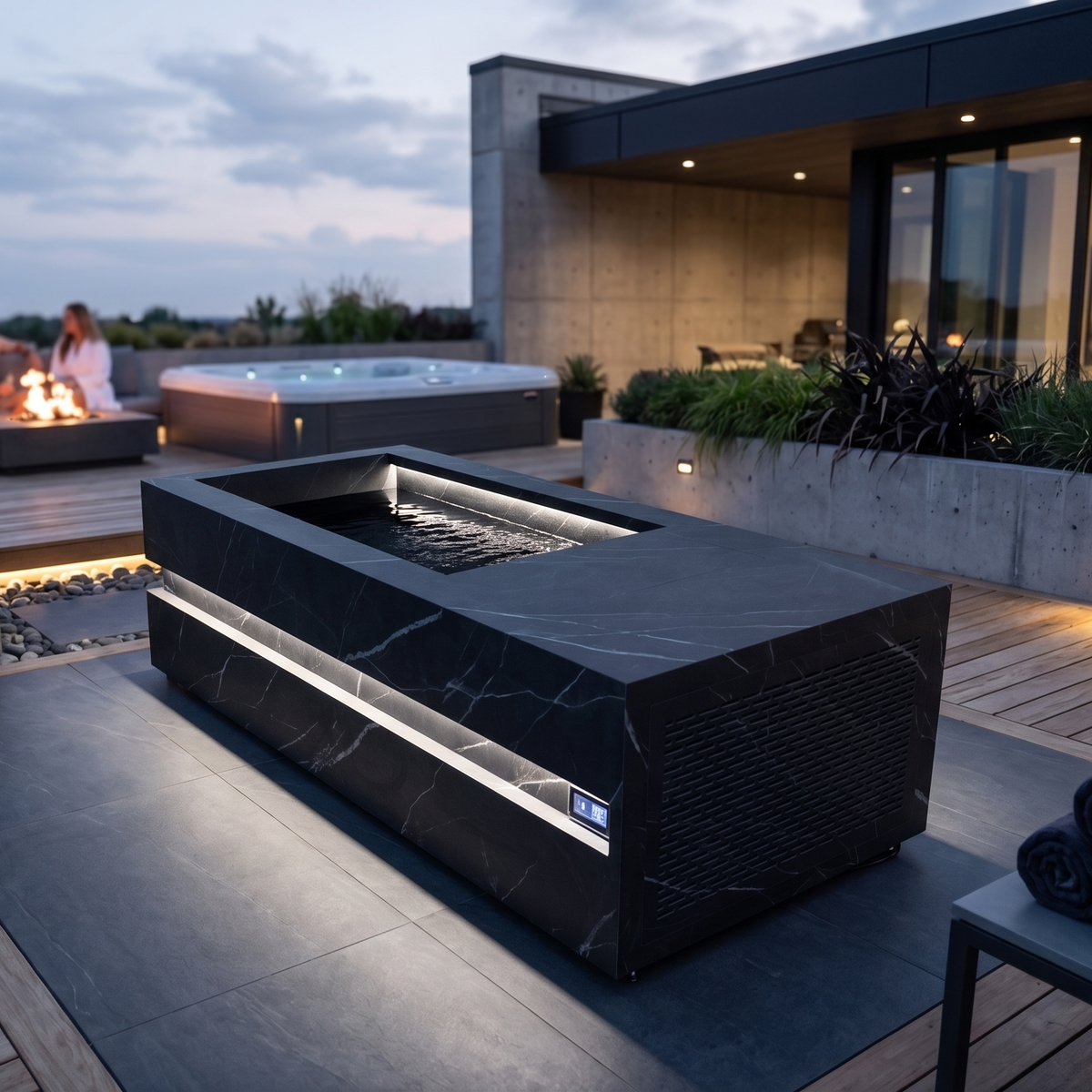 Loki Calacatta Black cold plunge on a rooftop terrace at dusk